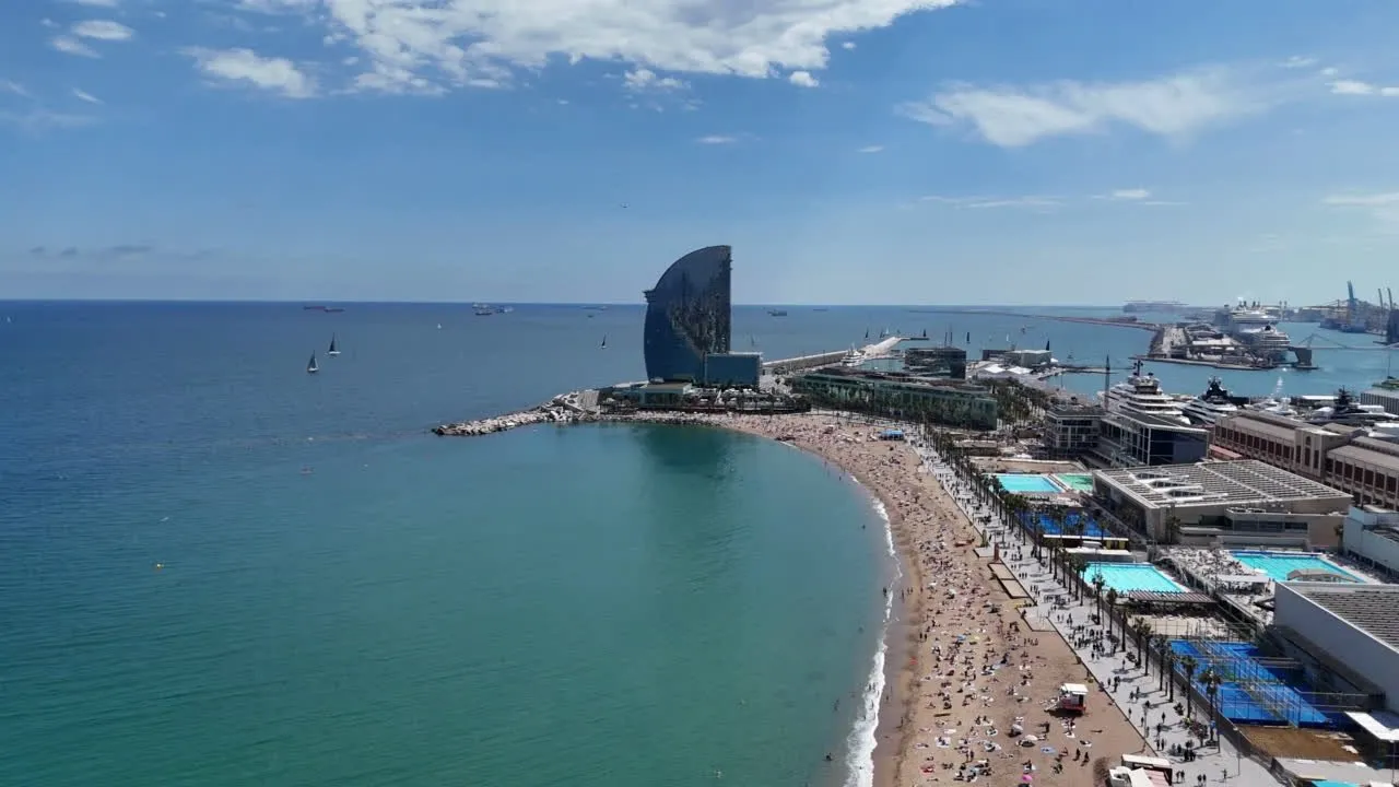Aerial view of Barceloneta Beach curving along the Mediterranean