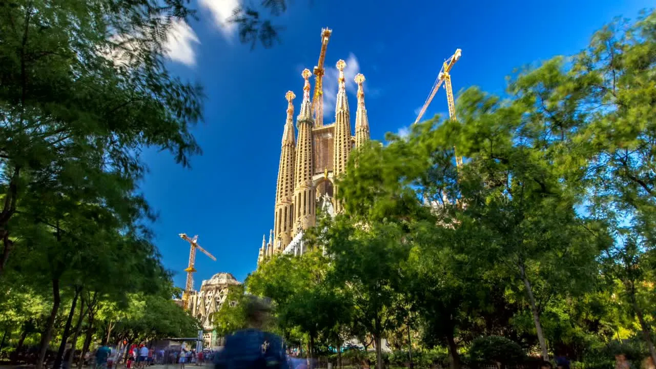 The spires of the Sagrada Família rising above the trees