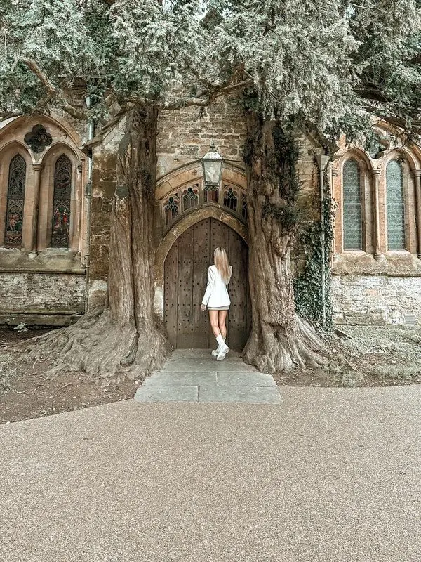 The tree-framed north door of St Edward’s Church in Stow on the Wold